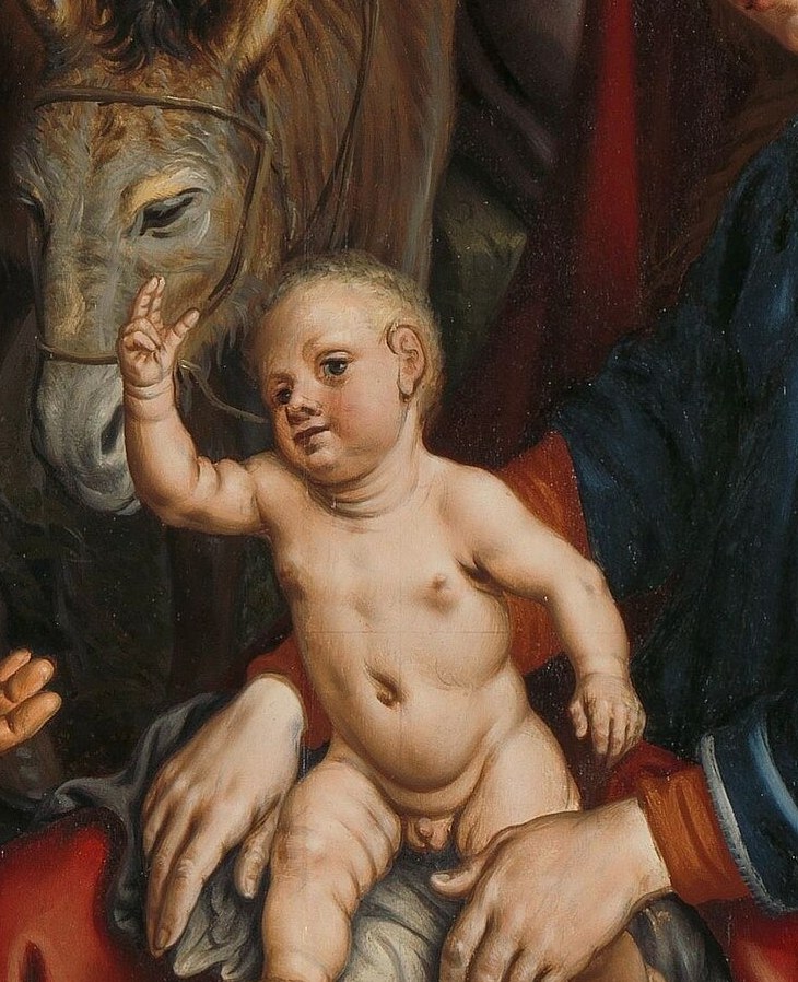 His gesture is surprisingly active and commanding for an infant, suggesting divine awareness.