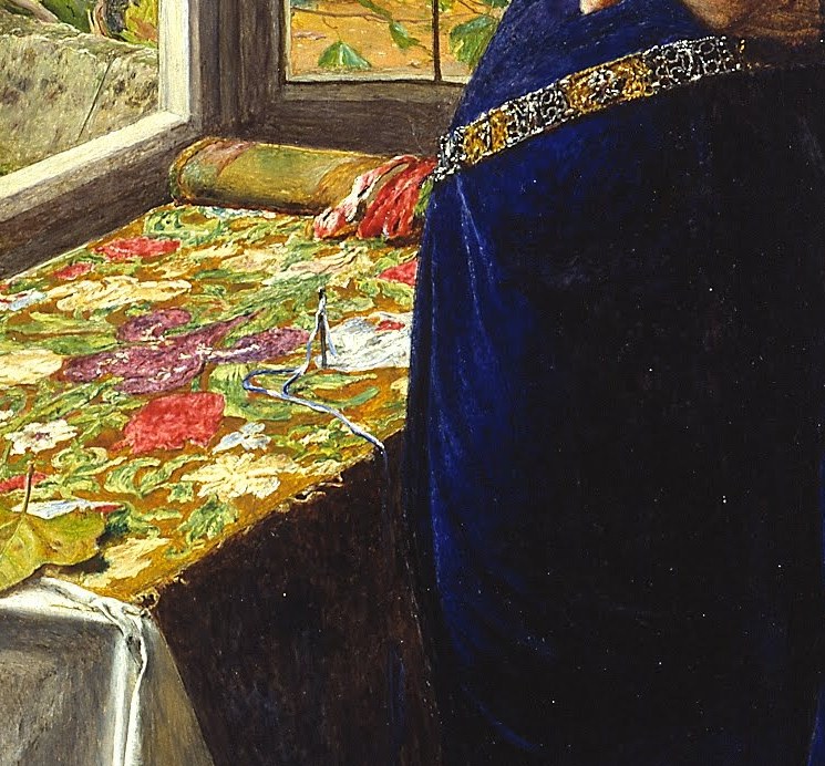 Look closely at the richly embroidered tablecloth.