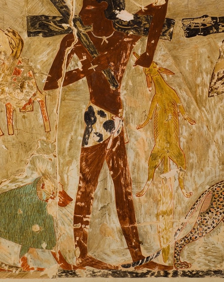 Another figure brings a pole with various animals.