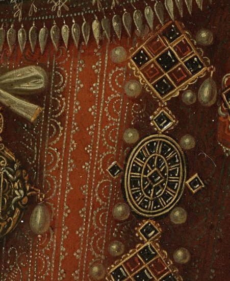 This ornate piece of jewelry, with its dark stones and pearls, is a focal point of her regalia.