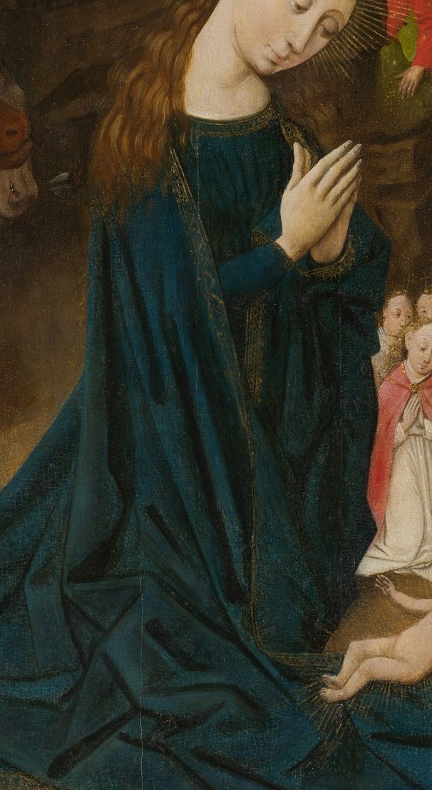 Her posture of prayer and serene expression evoke deep devotion and maternal love.