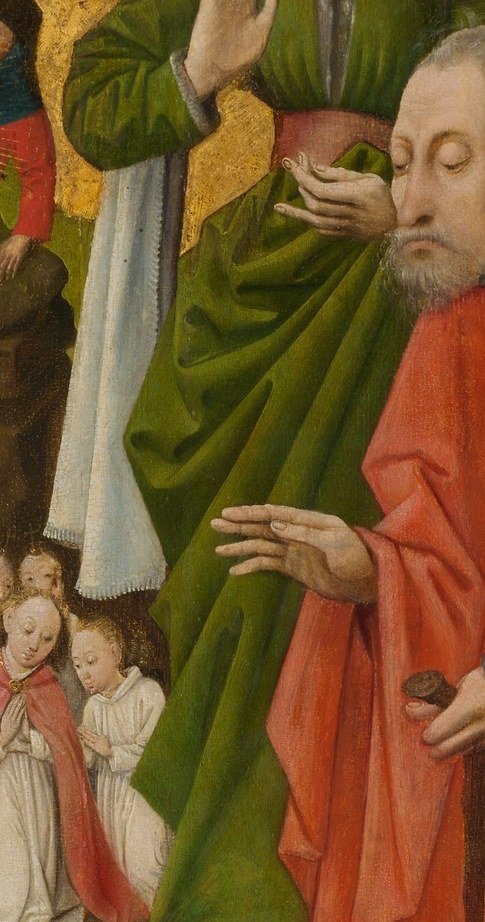 A woman in green holds a cloth to her face, lost in thought.