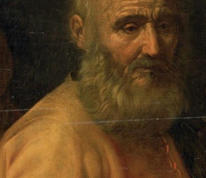 His weathered face and direct gaze convey a sense of gravitas and authority.