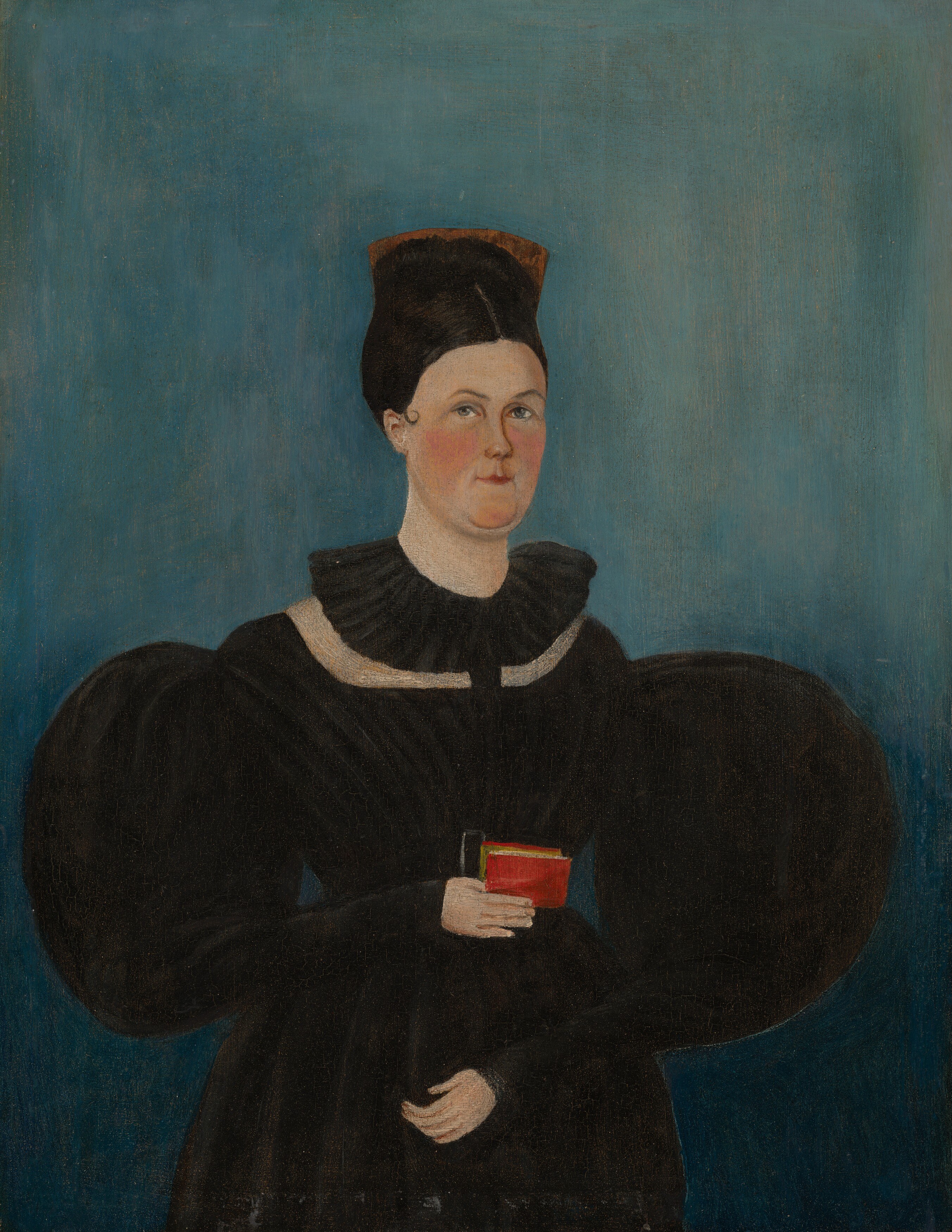 The plain, deep blue background isolates the figure and creates a sense of depth and quietude.