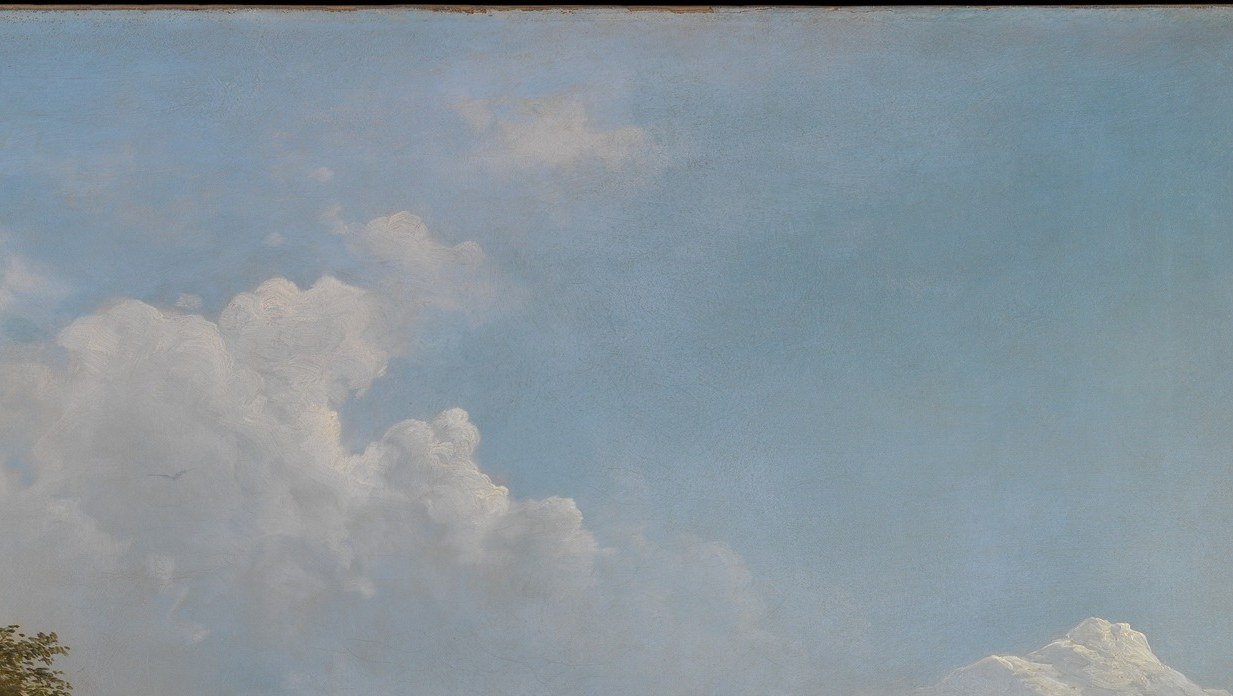 Theatrical atmospheric drama; the clouds stack from flat horizon haze to tall pillar, giving the sky as much topographic interest as the mountains below