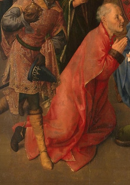 The first king kneels, his rich robes a testament to his reverence.
