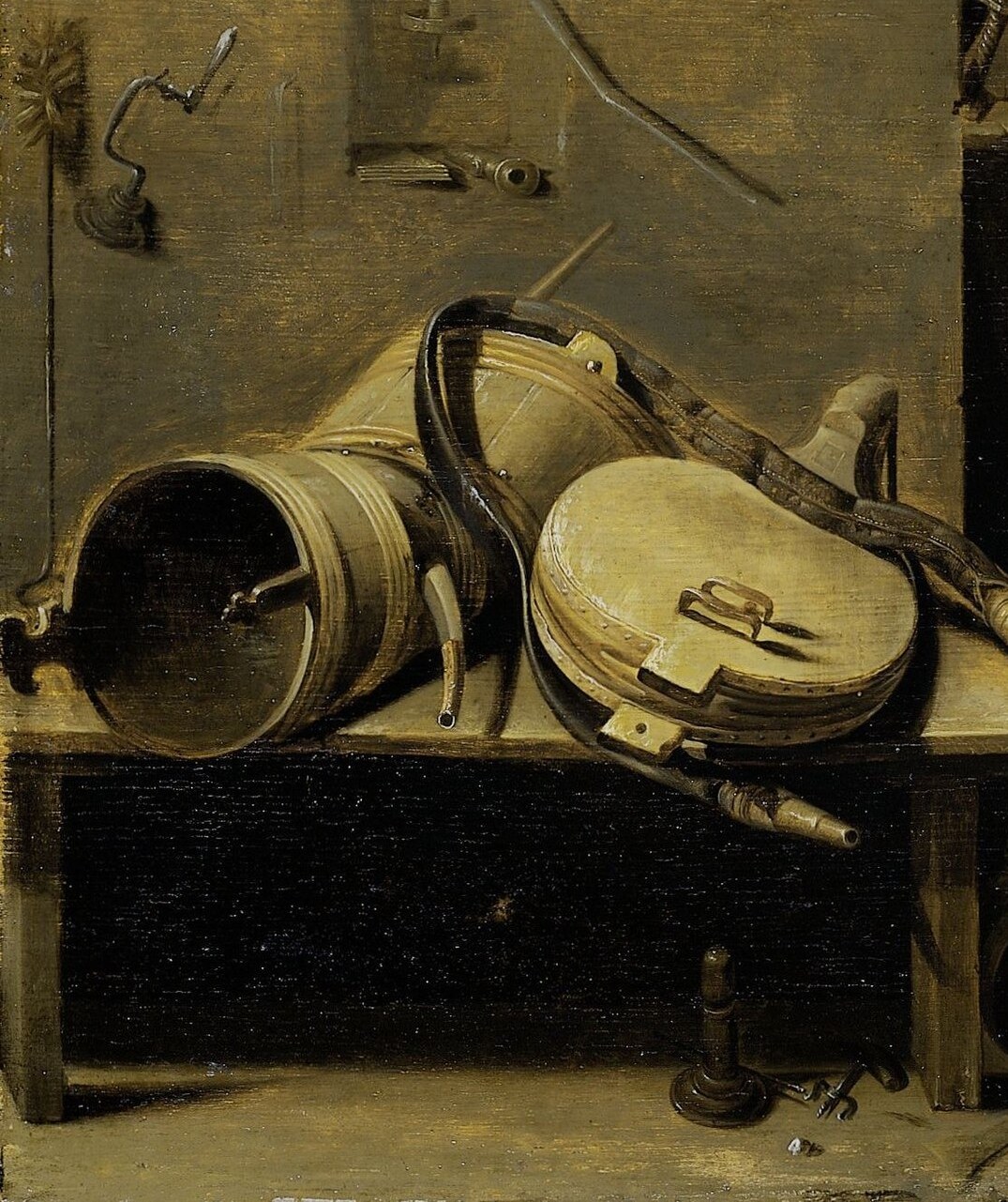 A drum sits among the wine vessels.