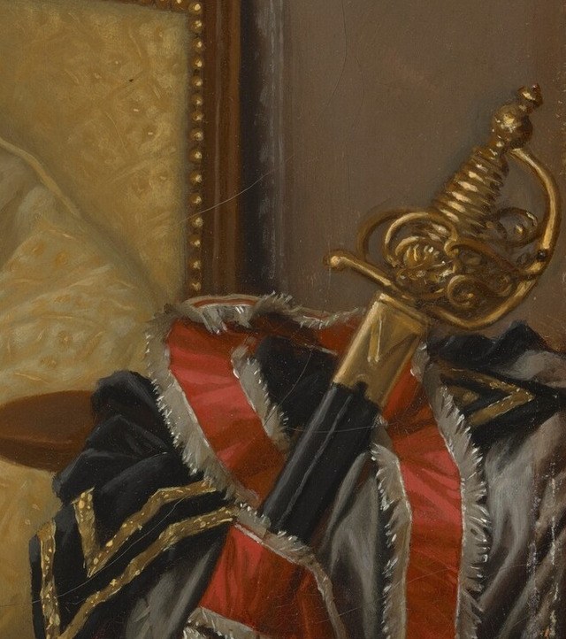 This sword hilt reinforces a theme of conflict or loss.