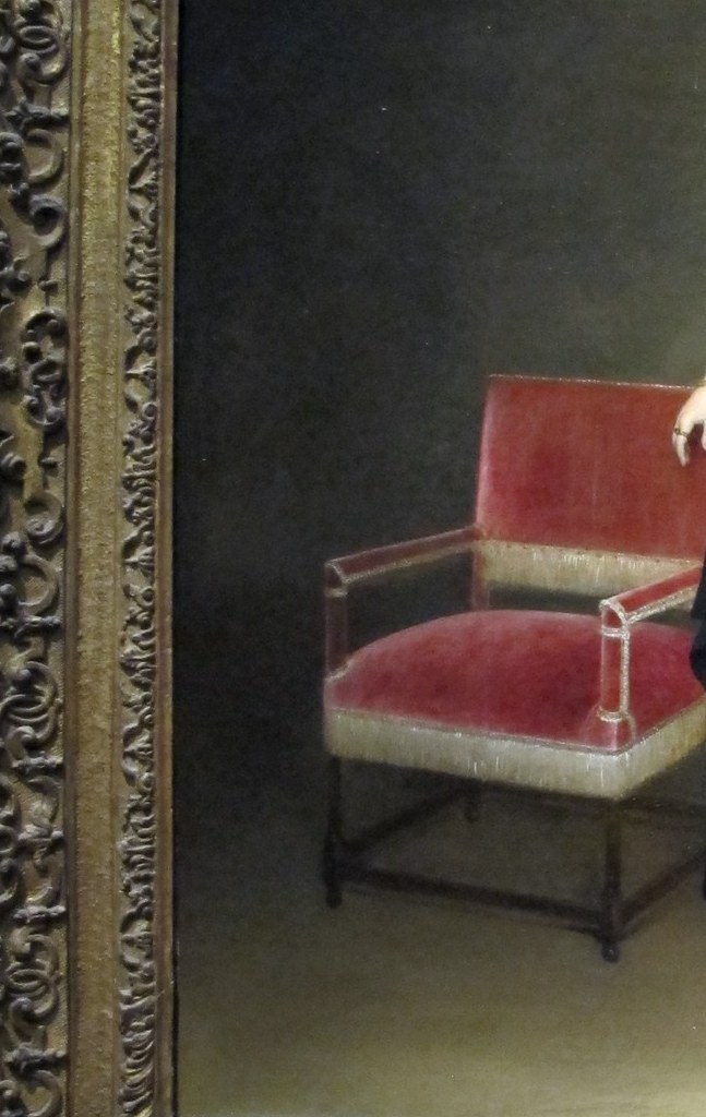 The soft velvet of the chair catches light differently.