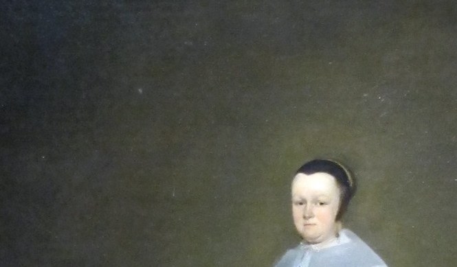 The brightest point in an otherwise dark palette , a deliberate luminous status signal and a demonstration of Ter Borch's ability to render delicate textile against black.