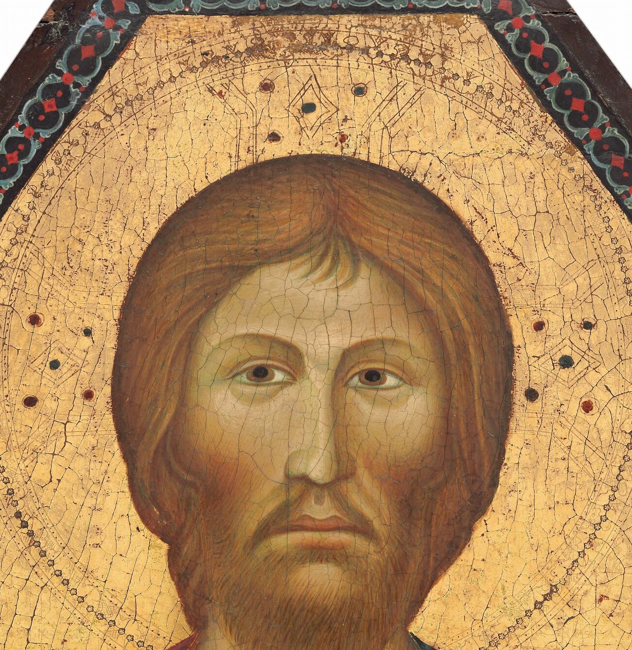The gold background flattened time. The face stared outward, unchanged.