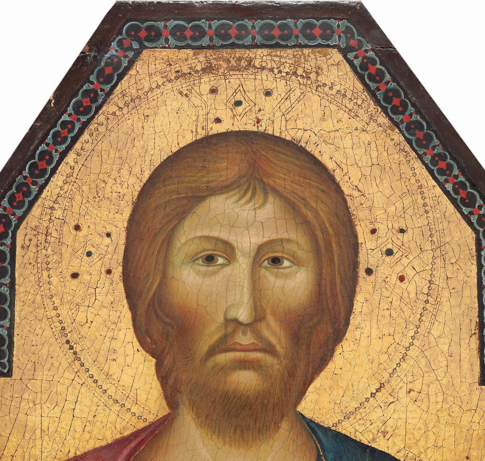Flat beaten gold leaf halo signals sanctity; its incised decorative border shows the panel's exceptional preservation and craft.