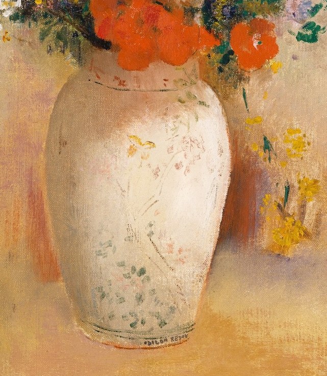 Look closely at the ornate white vase.