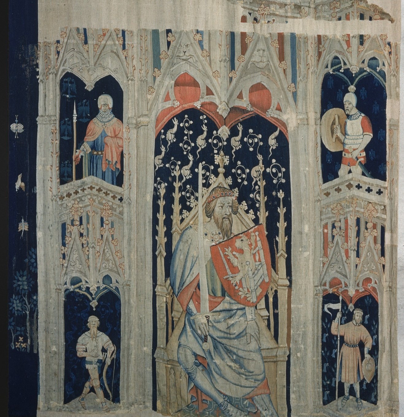 The heraldic 'semé of stars' field is not generic decoration , star arrangements in courtly tapestries often encode the patron's blazon or cosmological ideology
