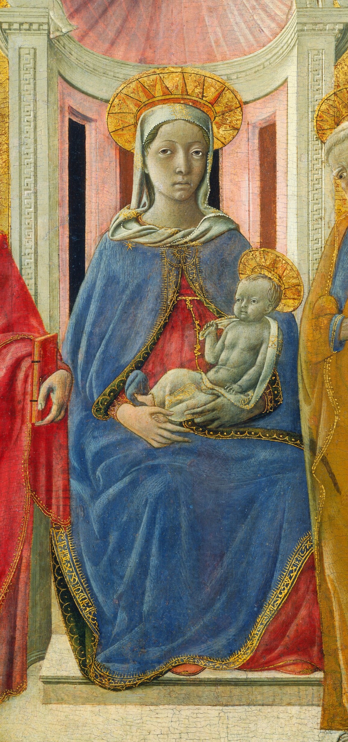 Her blue mantle is ultramarine, the costliest pigment of 1430.