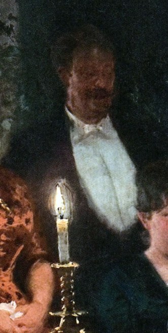 The light source: a man holding a candle.