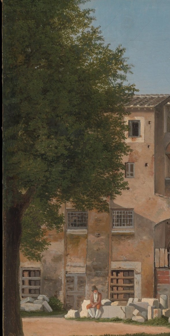 Its dense foliage frames the left side of the composition and adds a natural element.