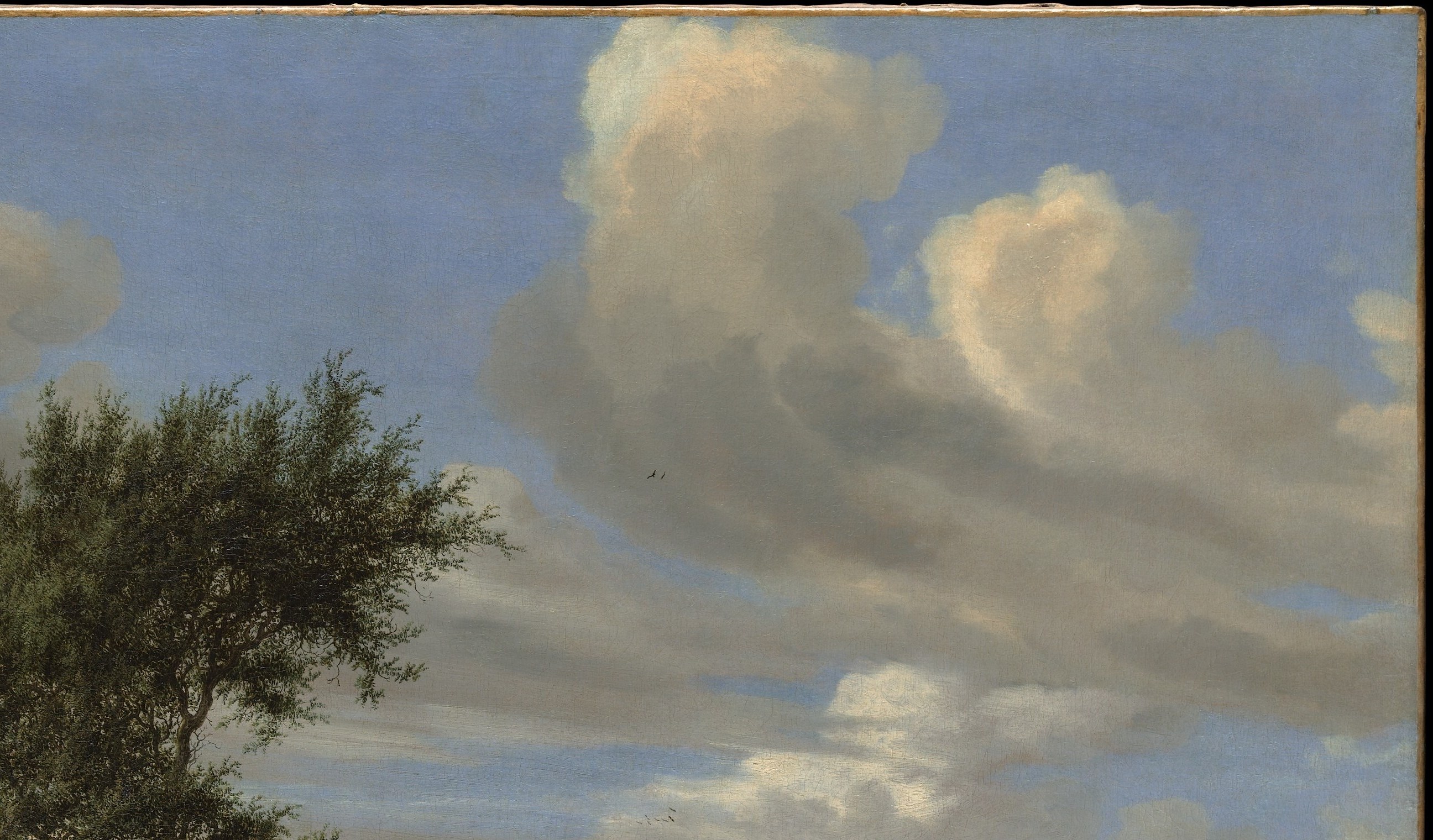 Van Ruysdael's signature achievement , the volumetric, layered cloud bank occupies nearly half the canvas and is the main display of his atmospheric technique.