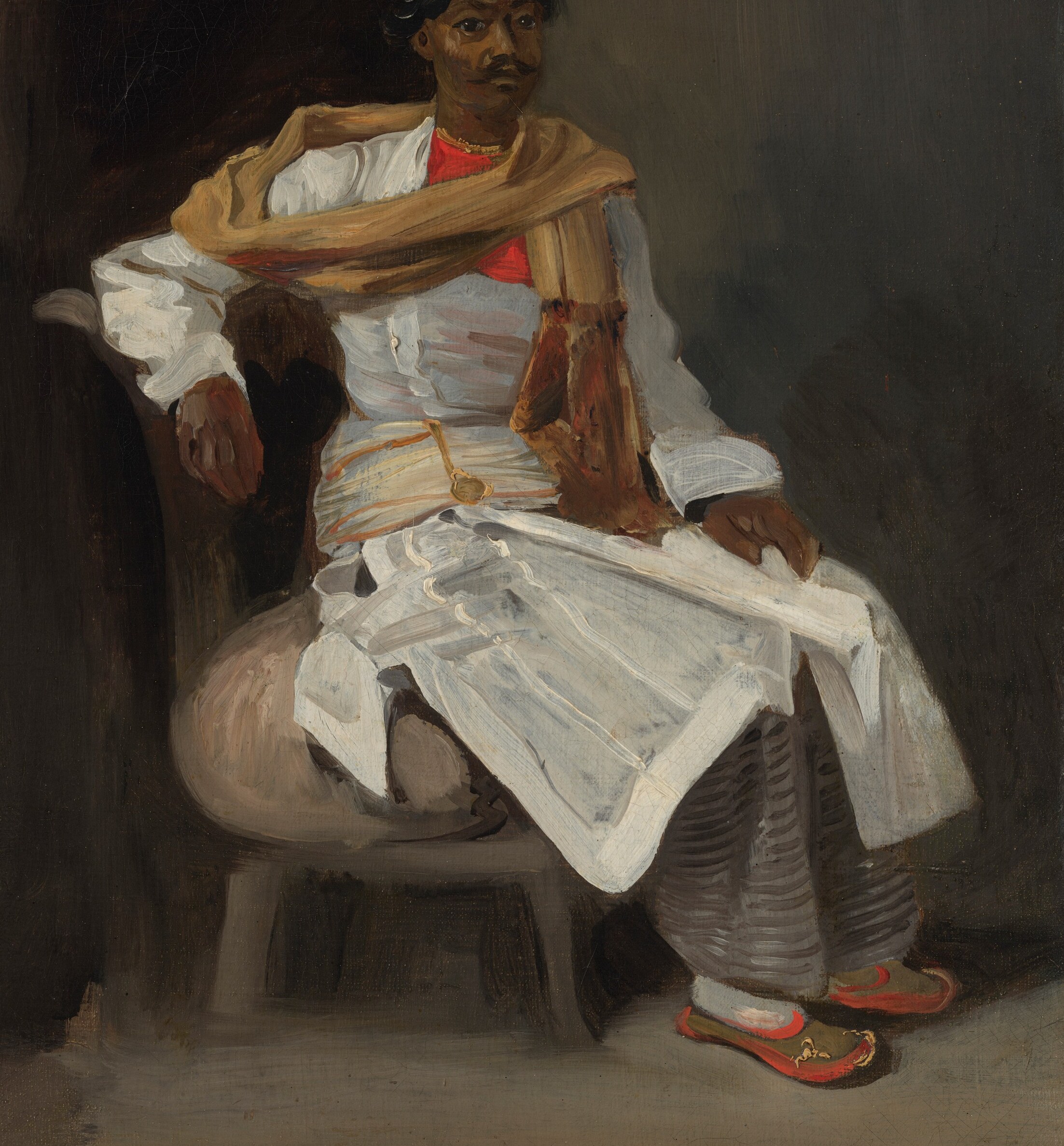 Then a second pose: seated, softer, lost in his own thoughts.