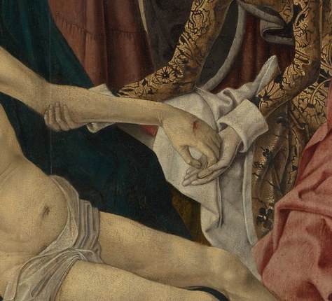 The lifeless arm extending in a downward diagonal is a standard Pietà shorthand for dead weight; the stigma wound on the wrist may be visible and is a key devotional marker.
