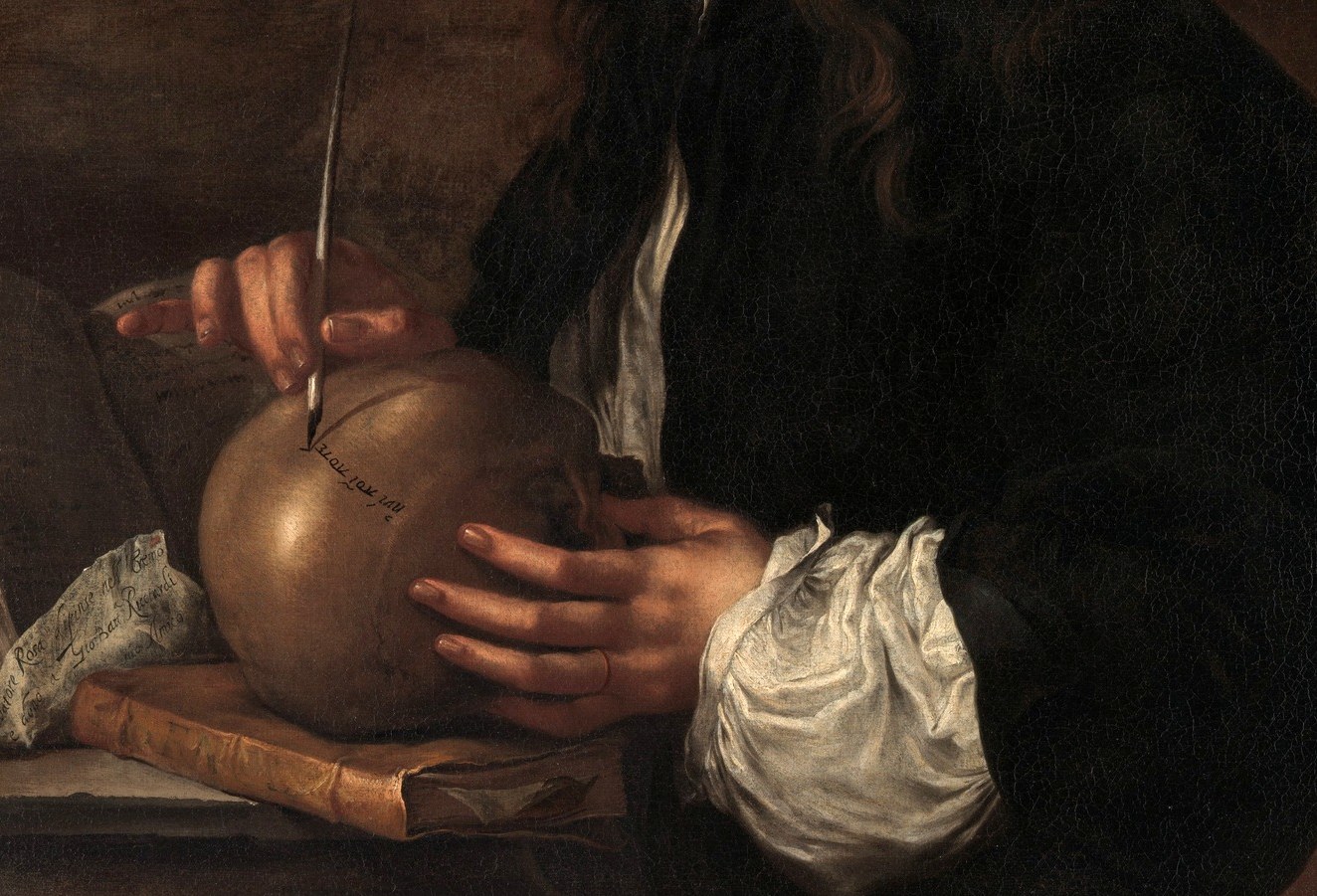 Hands doing intellectual labor, not idle display; the cradle-grip humanizes the vanitas object and gives the composition its stillness