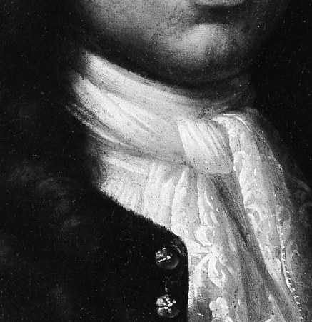 Notice the elegant white neck scarf and lace cuffs.