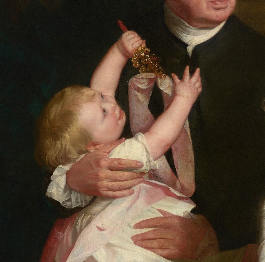The child reaches for a chain, symbolizing hope for the future.