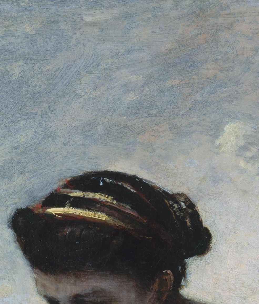 Her eyes are cast fully downward onto the page , the viewer never gets her gaze, only the absorption itself, making her inner state the real subject.