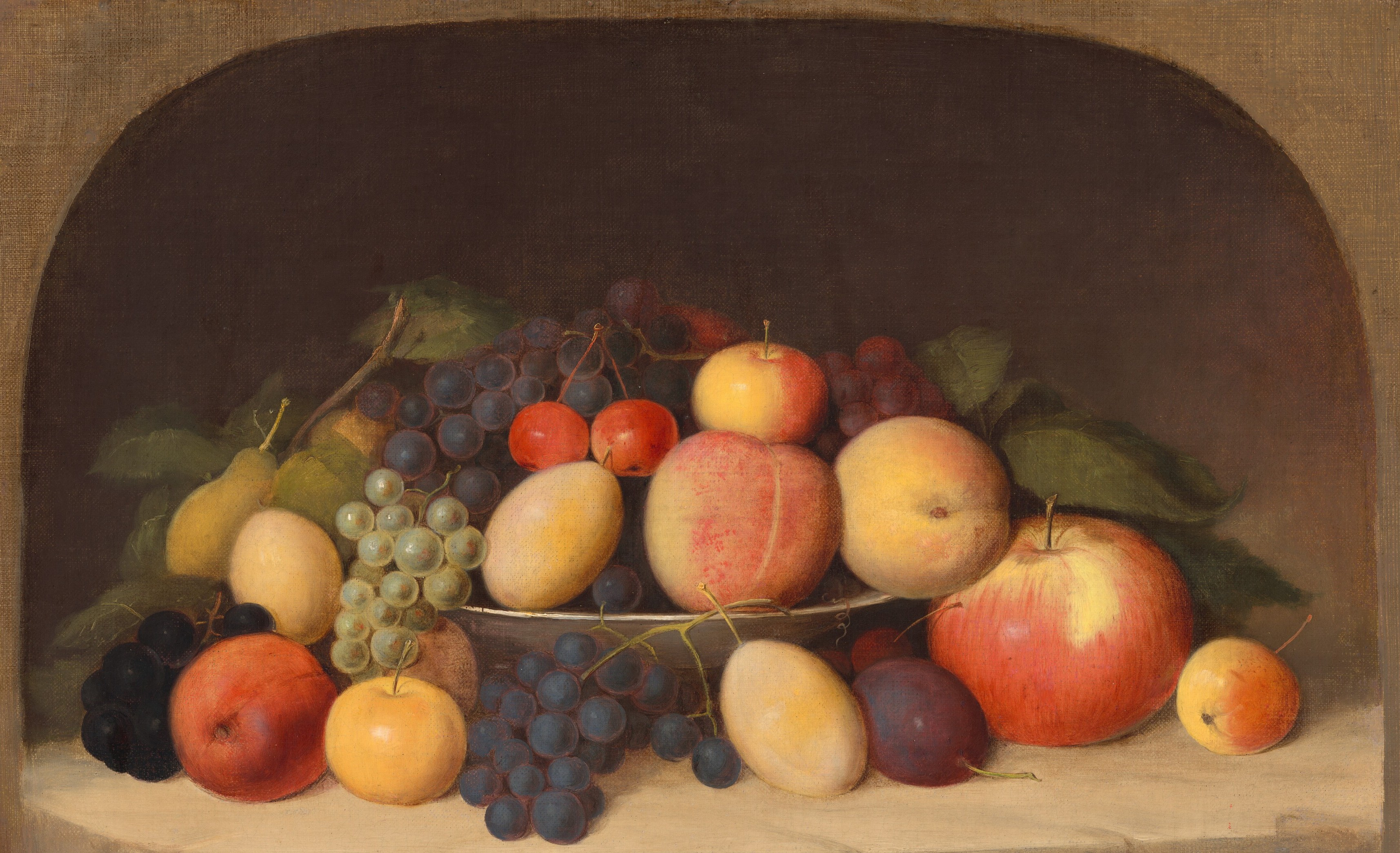 The trompe-l'œil niche gives depth and architectural gravity to a modest tabletop subject; the muted ochre-grey stone sets off every color in the fruit without competing.