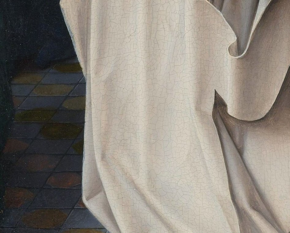 The Carthusian monk on the left folds his hands in prayer.