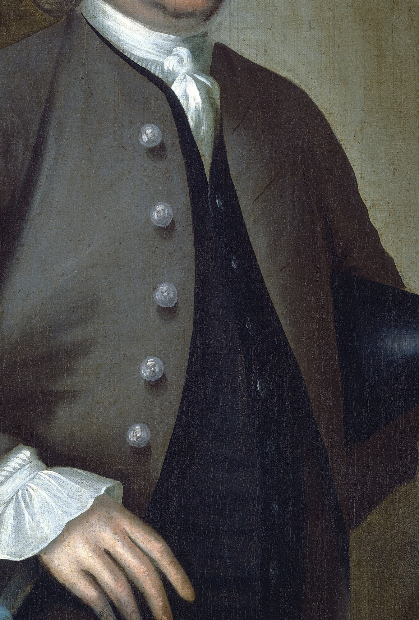 The subtle sheen and folds of the jacket suggest quality fabric and tailoring, hinting at his material success.