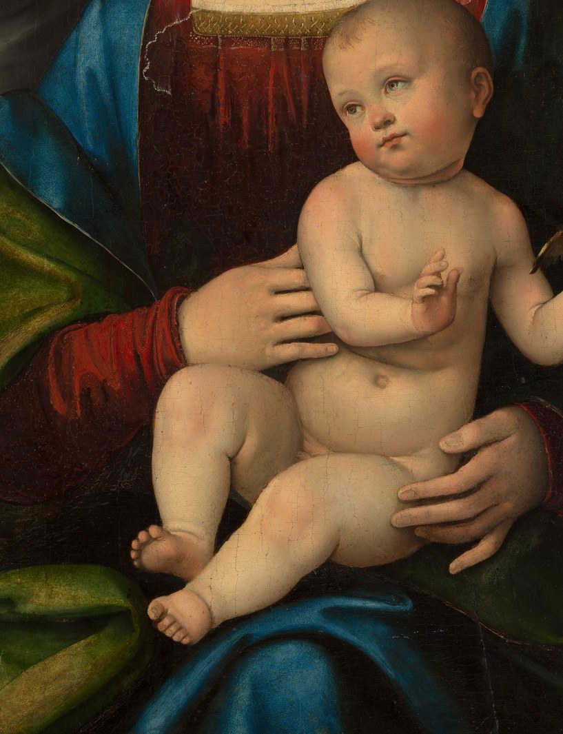 Fully nude infant rendered with sculptural softness; the central visual mass around which all four figures are organized.
