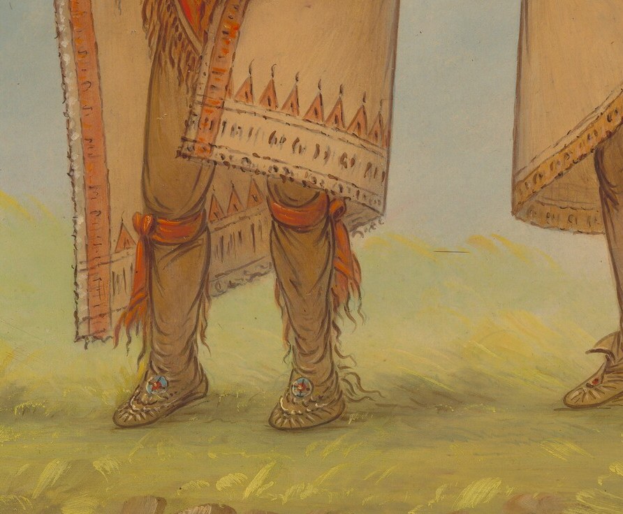The intricate red and white patterns on his clothing highlight the artistry and cultural significance of his attire.