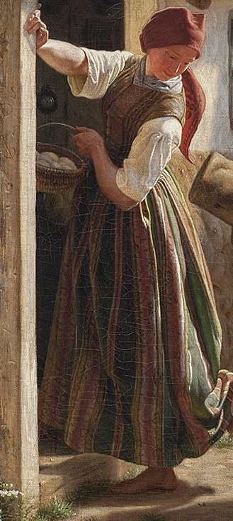 She waits in the doorway, a basket in hand.