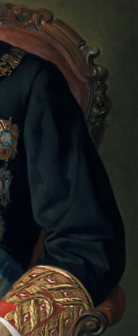 Notice the detailed carving on his chair, suggesting his wealth.