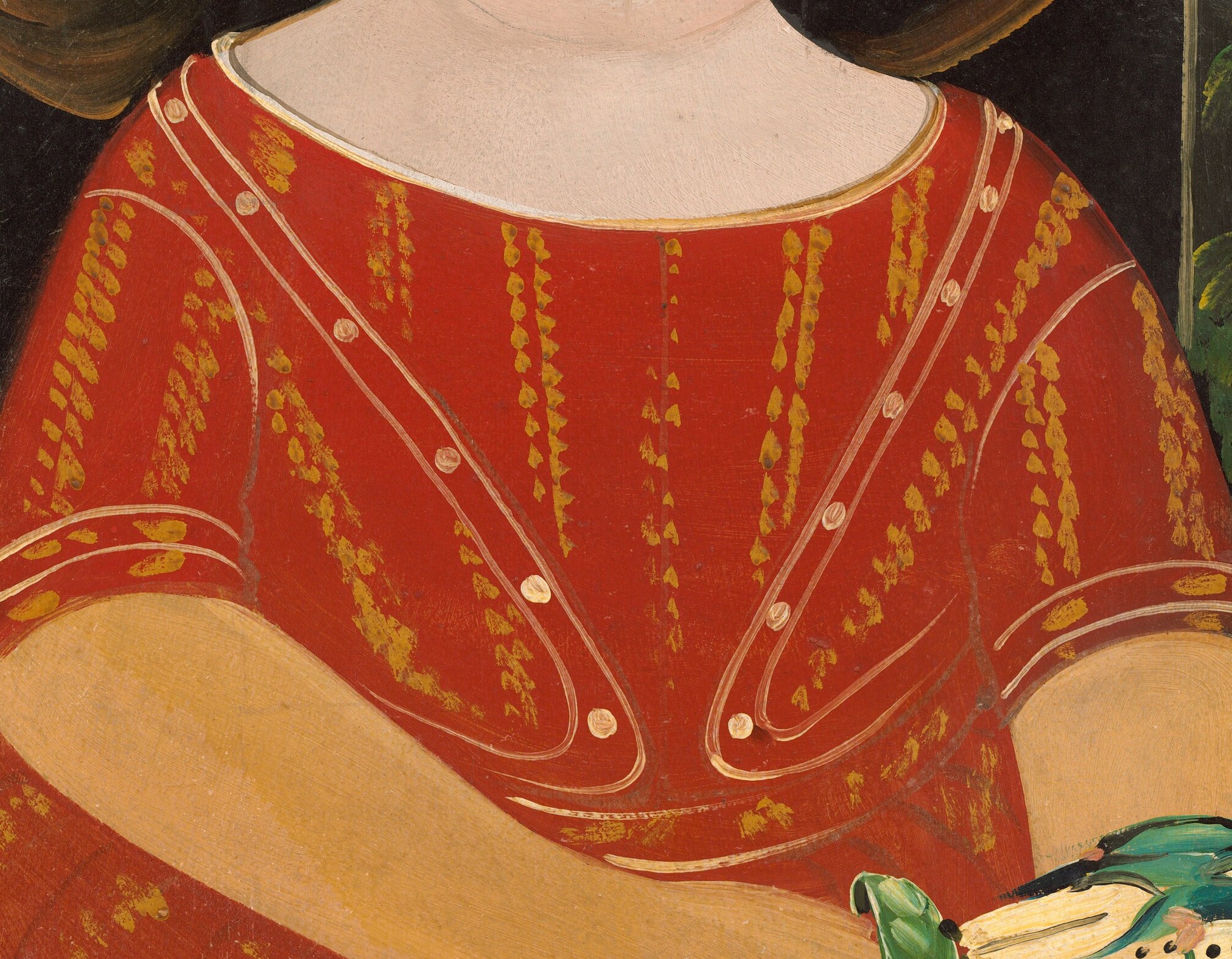 His red garment with gold trim suggests a special occasion.