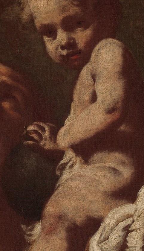 He carries a child across a river.