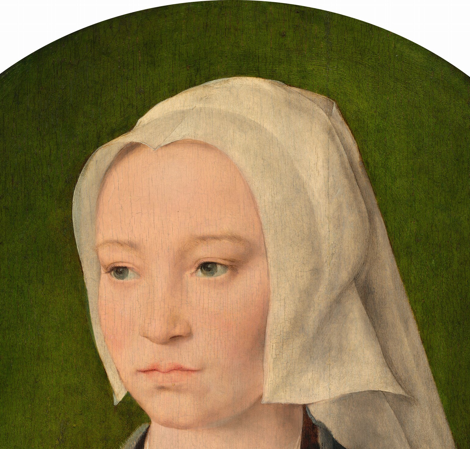 The architectural fold of the white headdress frames the face and signals married bourgeois status in early 16th-century Antwerp