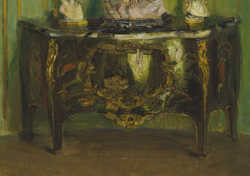 The table's polished surface and ornate legs speak to the luxury and craftsmanship of the furnishings.