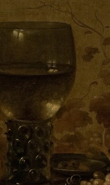 Dark wine in a tall glass.