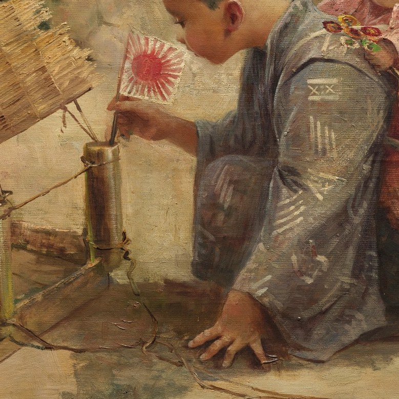 This boy is building something intricate and small.