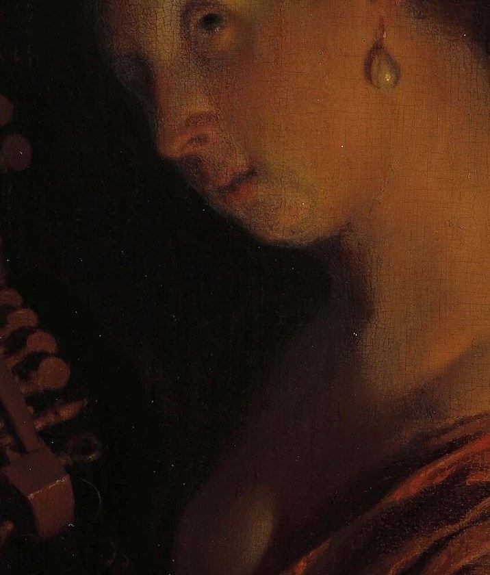 Her face is almost entirely illuminated by the warm glow.