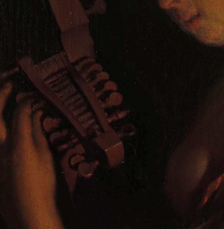Look at the delicate way she touches the instrument's strings.