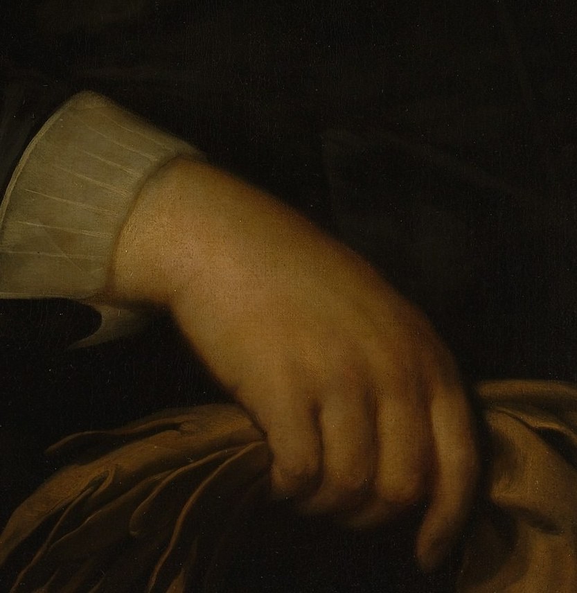 He holds a folded document, a subtle sign of his affairs.