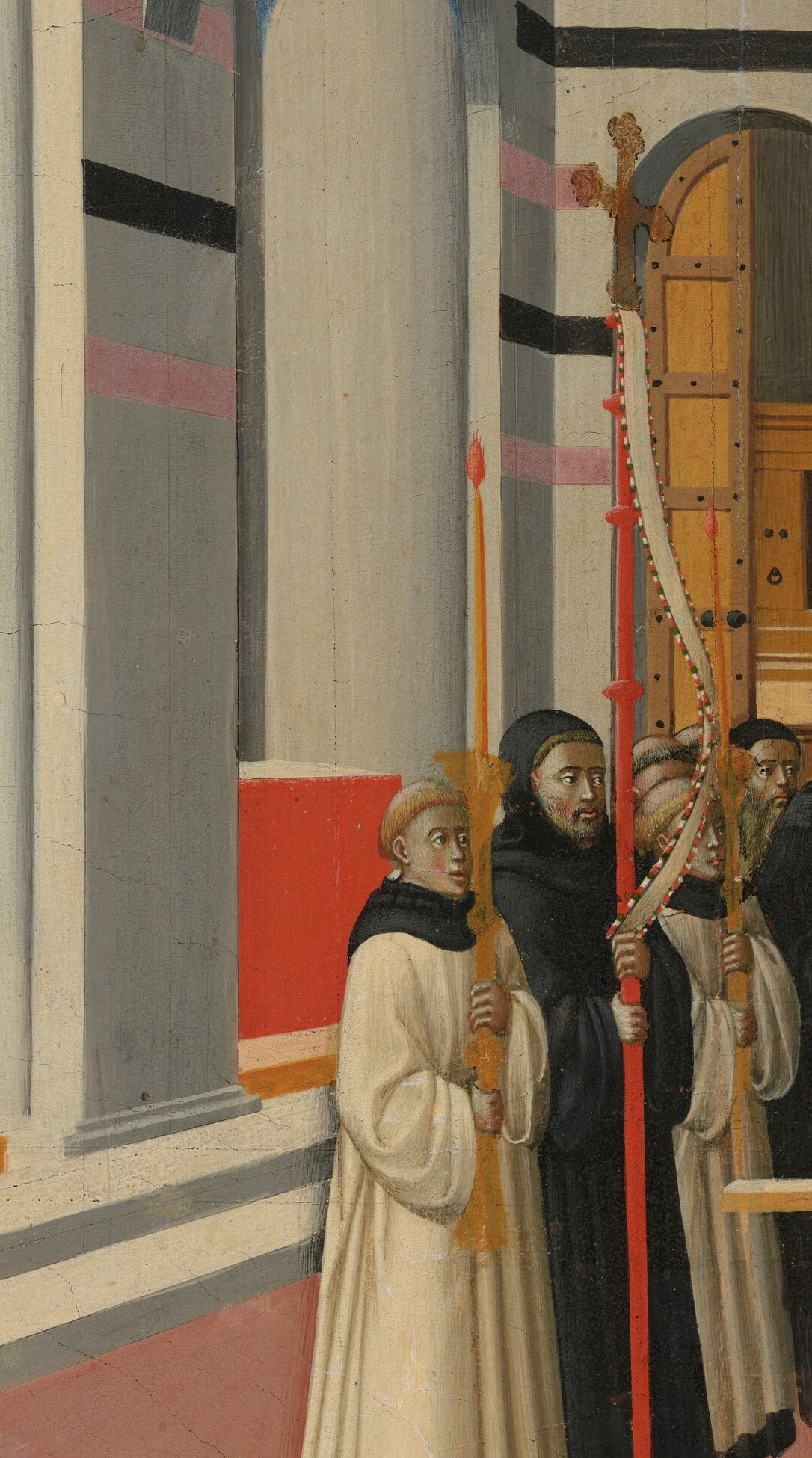 The monks in white stand apart from the dark robes.