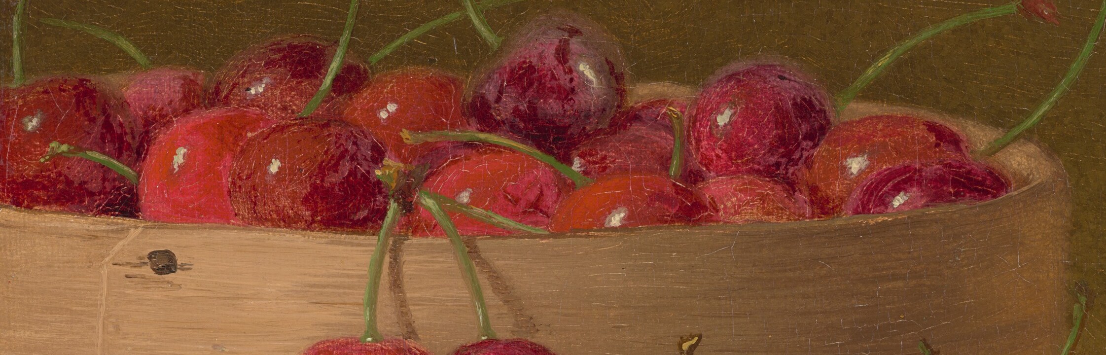 These cherries, piled high, show a variety of ripeness and texture, suggesting abundance and the peak of the season.