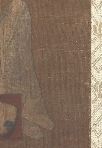 The figure, a revered Jain teacher, rises from a lotus.