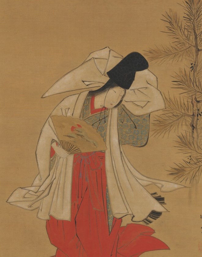 Her elaborate white robe layers over a vibrant red kimono.
