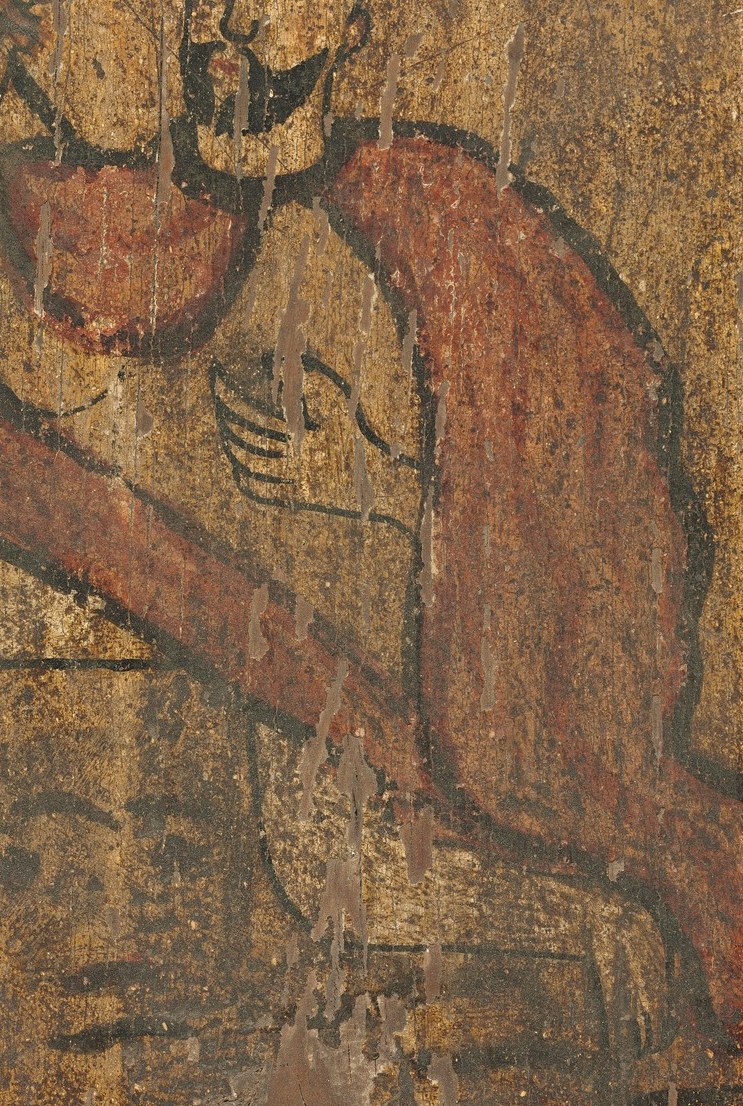 The vibrant red robe would have stood out in a church.