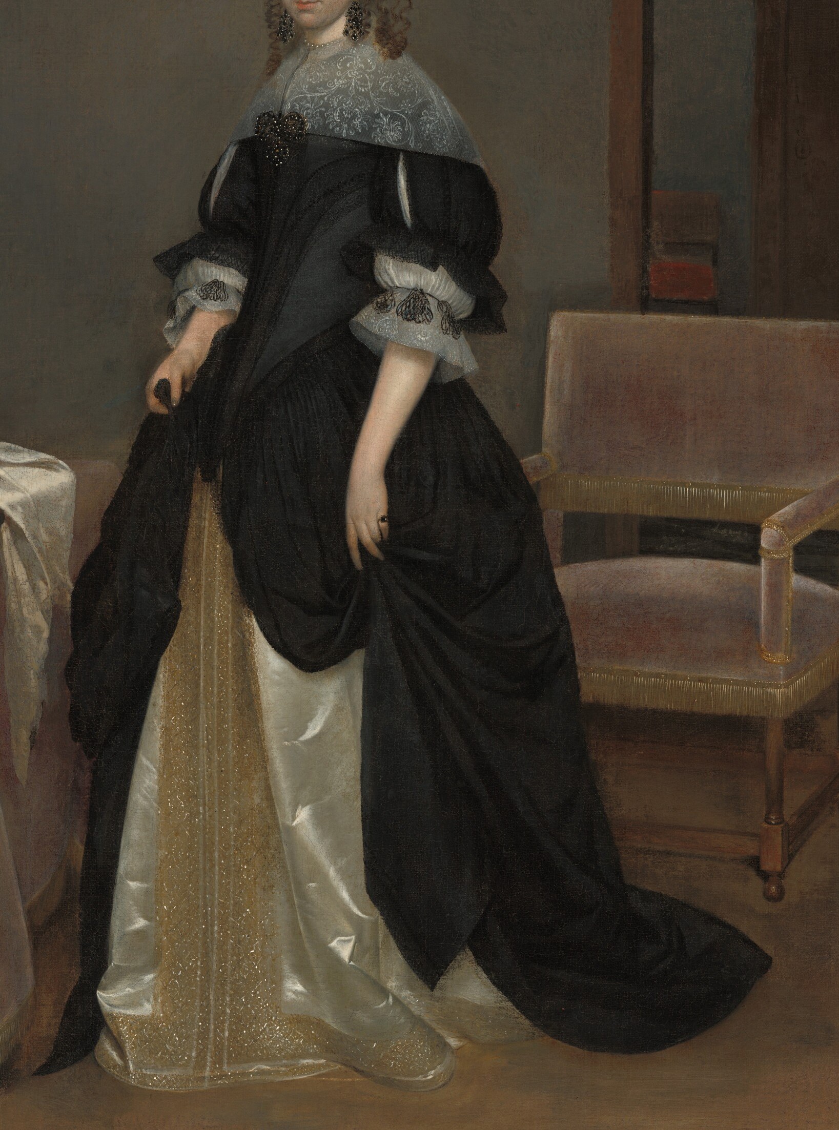 Her opulent dress shows her wealth and status.